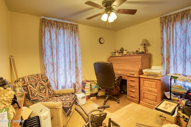 office space with carpet floors and ceiling fan