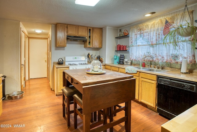 kitchen featuring black dishwasher, white range, under cabinet range hood, open shelves, and a sink