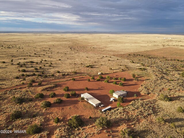 birds eye view of property featuring a rural view