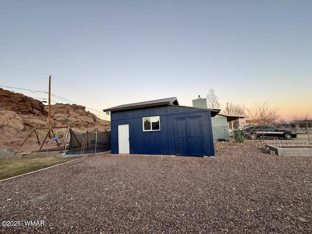 view of shed with a trampoline