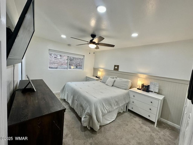 bedroom featuring wainscoting, recessed lighting, ceiling fan, and light colored carpet