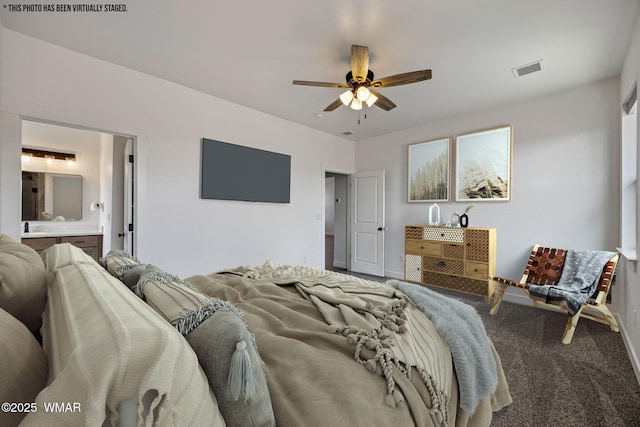 7141 Pair O Dice Rd, Show Low, AZ 85902 - carpeted bedroom featuring connected bathroom and ceiling fan
