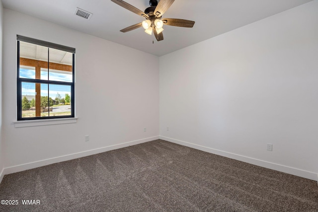 7141 Pair O Dice Rd, Show Low, AZ 85902 - empty room featuring dark colored carpet, baseboards, and a ceiling fan