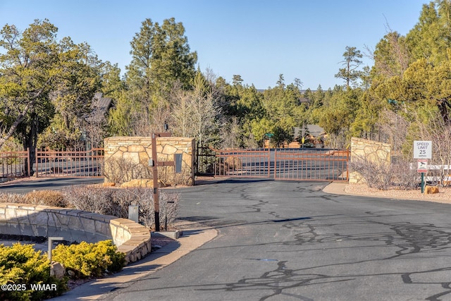 view of gate featuring fence