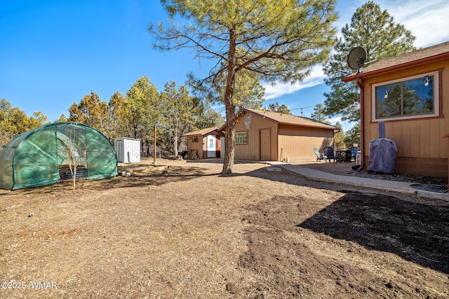 exterior space featuring an exterior structure and an outdoor structure