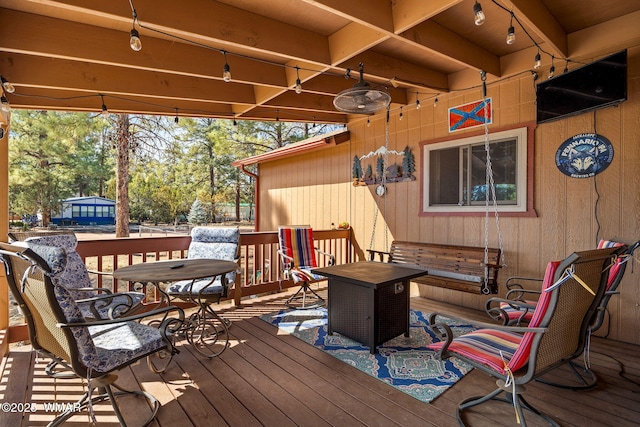 wooden deck with ceiling fan