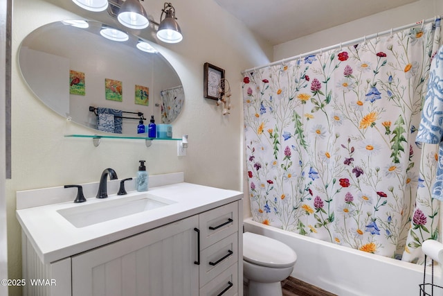 full bathroom featuring vanity, shower / bath combo with shower curtain, and toilet