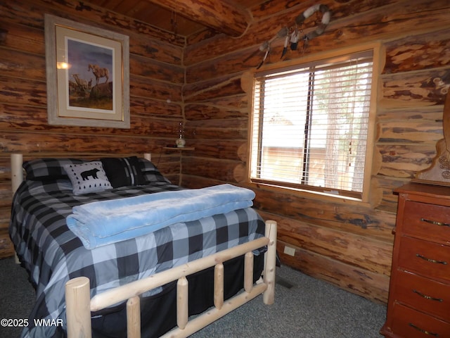 30 County Road 2066, Alpine, AZ 85920 - carpeted bedroom with wooden walls and beamed ceiling
