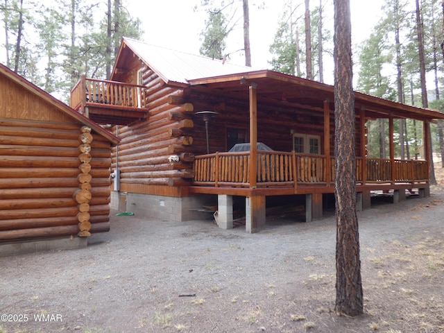 30 County Road 2066, Alpine, AZ 85920 - rear view of property with log siding and metal roof