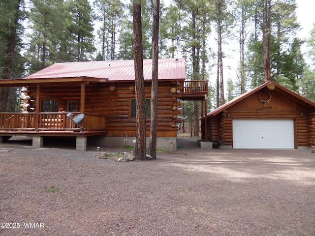 30 County Road 2066, Alpine, AZ 85920 - log home with aphalt driveway, metal roof, an outdoor structure, and log exterior