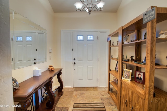 6646 Broken Arrow Way, Show Low, AZ 85901 - foyer with a chandelier and baseboards