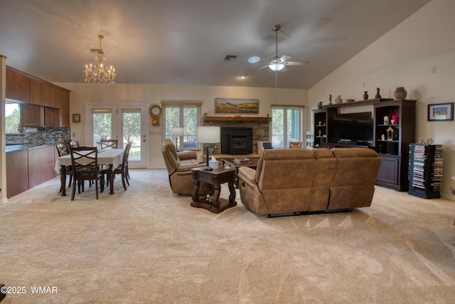 6646 Broken Arrow Way, Show Low, AZ 85901 - living room with light carpet, a chandelier, vaulted ceiling, a stone fireplace, and ceiling fan