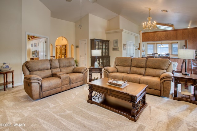 6646 Broken Arrow Way, Show Low, AZ 85901 - living room with arched walkways, carpet, a chandelier, high vaulted ceiling, and ceiling fan