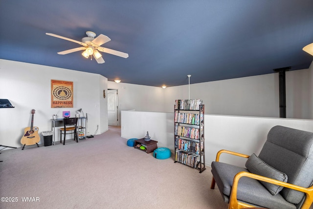 living area with carpet floors and ceiling fan