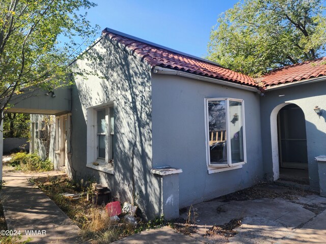 240 S 1st, Saint Johns, AZ 85936 - view of property exterior with a tile roof and stucco siding