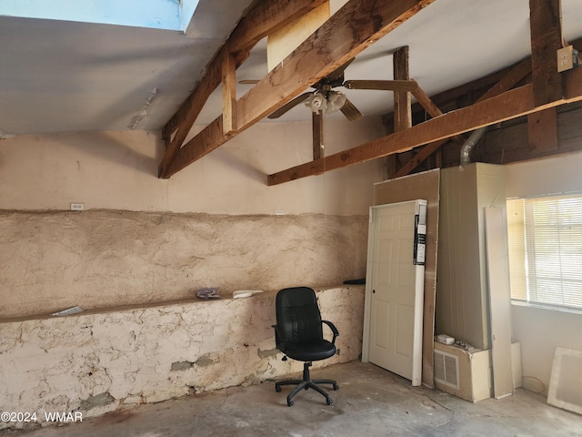 240 S 1st, Saint Johns, AZ 85936 - interior space featuring a skylight, beam ceiling, and unfinished concrete floors