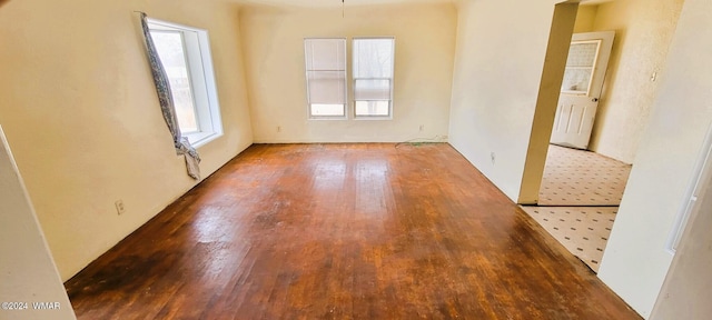 spare room with wood finished floors