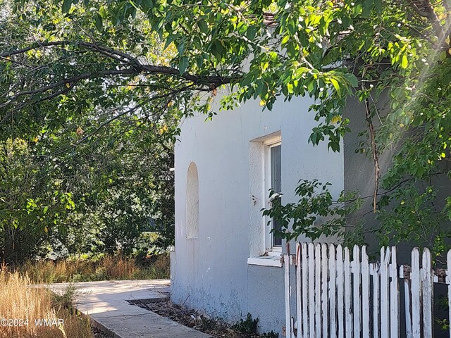 240 S 1st, Saint Johns, AZ 85936 - view of home's exterior featuring fence and stucco siding