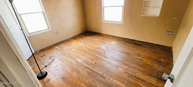 unfurnished room featuring wood finished floors