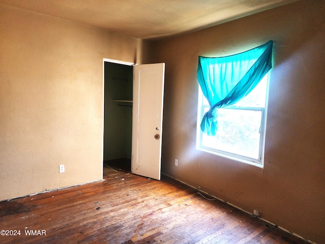 unfurnished bedroom featuring wood finished floors