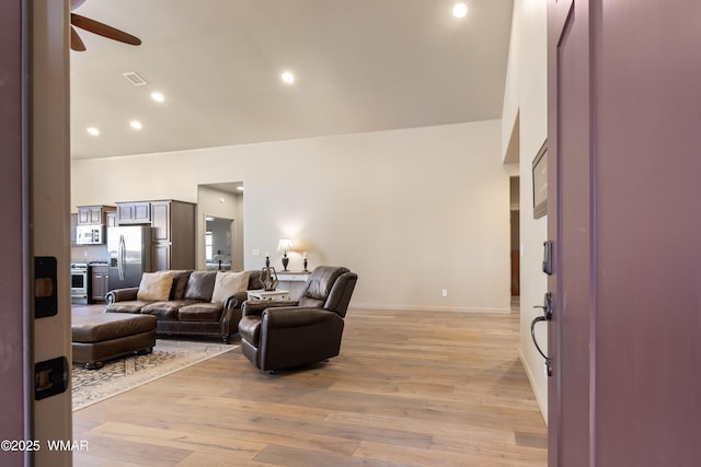 living area with light wood-style floors, visible vents, a ceiling fan, and recessed lighting