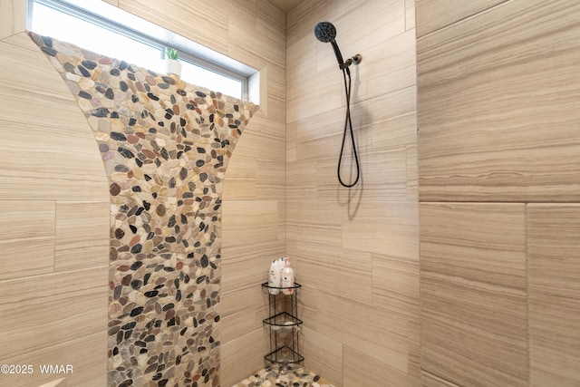 details featuring a tile shower