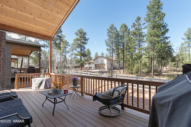 wooden deck featuring grilling area