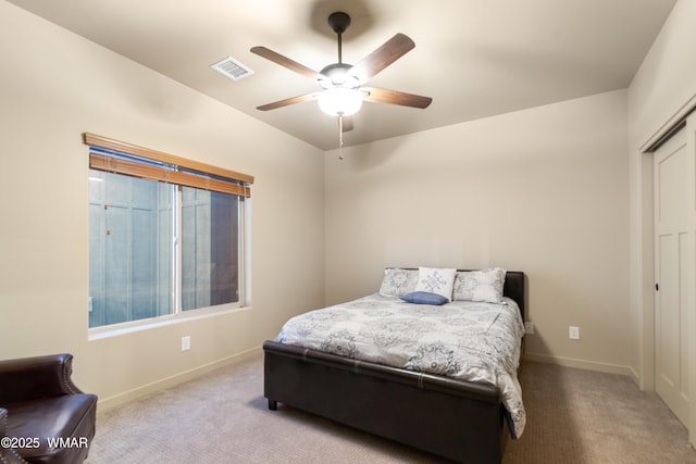 bedroom featuring carpet floors, a closet, visible vents, and baseboards