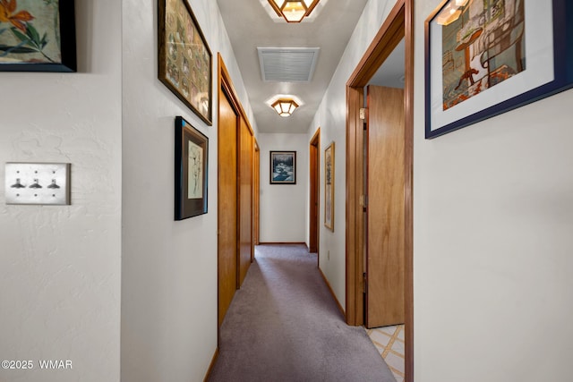 corridor featuring light colored carpet and visible vents