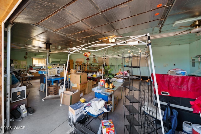 miscellaneous room featuring a garage and concrete floors