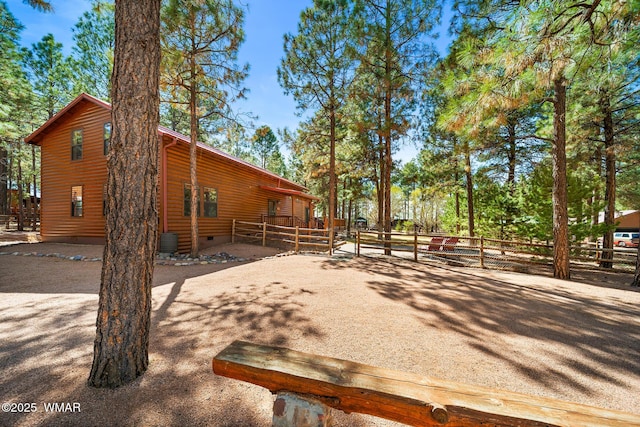 2722 Covered Wagon Trl, Overgaard, AZ 85933 - view of property exterior with crawl space and faux log siding