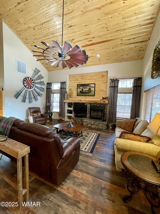 2722 Covered Wagon Trl, Overgaard, AZ 85933 - living area with lofted ceiling, wood ceiling, wood finished floors, a fireplace, and a ceiling fan