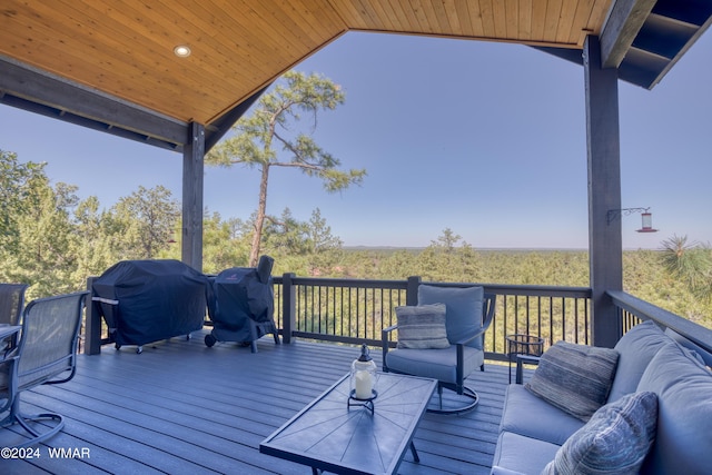 deck featuring an outdoor living space and grilling area