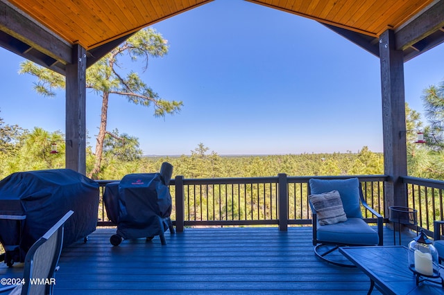 wooden terrace featuring a grill