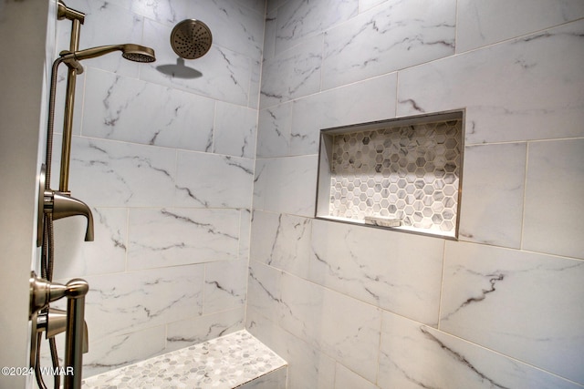 bathroom with a tile shower