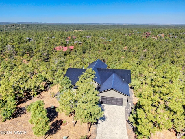 bird's eye view featuring a forest view