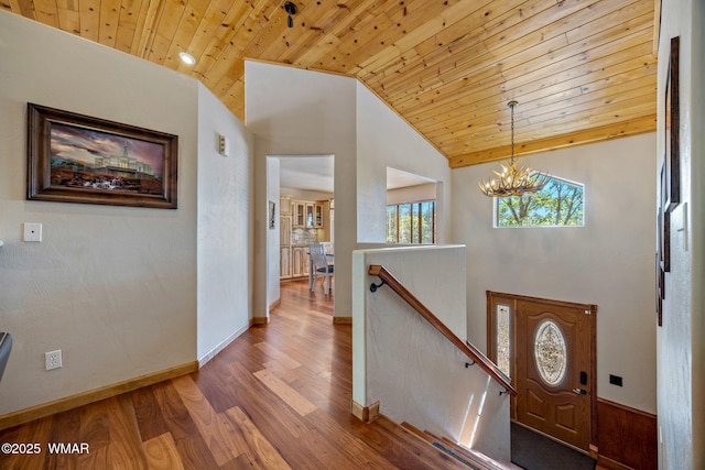 2190 Evergreen Ln, Show Low, AZ 85901 - entryway featuring wooden ceiling, wood finished floors, a chandelier, baseboards, and high vaulted ceiling