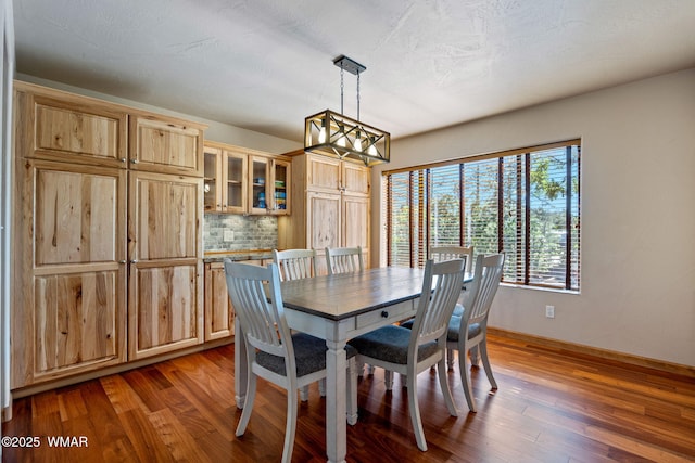 2190 Evergreen Ln, Show Low, AZ 85901 - dining room featuring a chandelier, wood finished floors, and baseboards