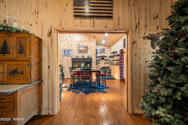 4683 Eagle Nest Ct, Lakeside, AZ 85929 - dining room with wooden walls, wood-type flooring, and lofted ceiling