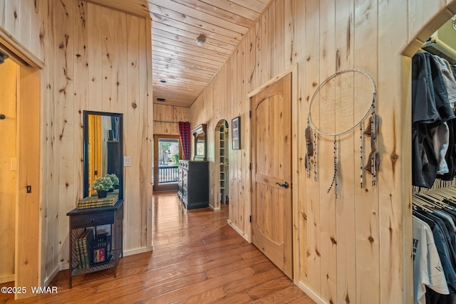 4683 Eagle Nest Ct, Lakeside, AZ 85929 - hall featuring wood walls, hardwood / wood-style flooring, wood ceiling, and arched walkways