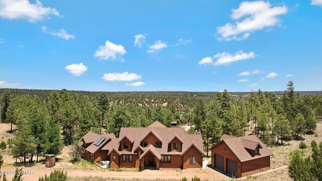 aerial view featuring a view of trees