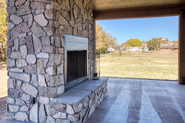 exterior space with wooden ceiling and an outdoor stone fireplace