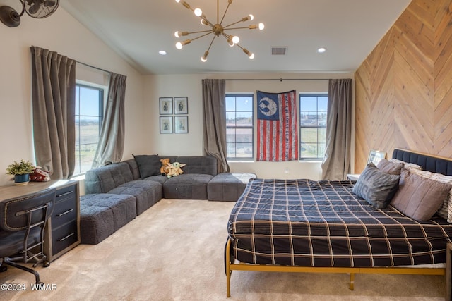 bedroom with lofted ceiling, a notable chandelier, wooden walls, carpet flooring, and visible vents