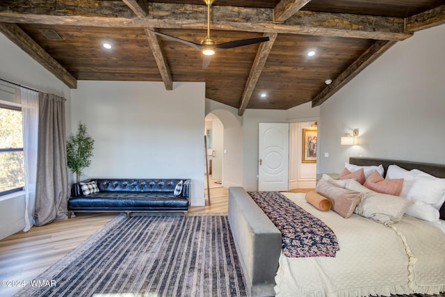 bedroom featuring arched walkways, wooden ceiling, visible vents, and wood finished floors