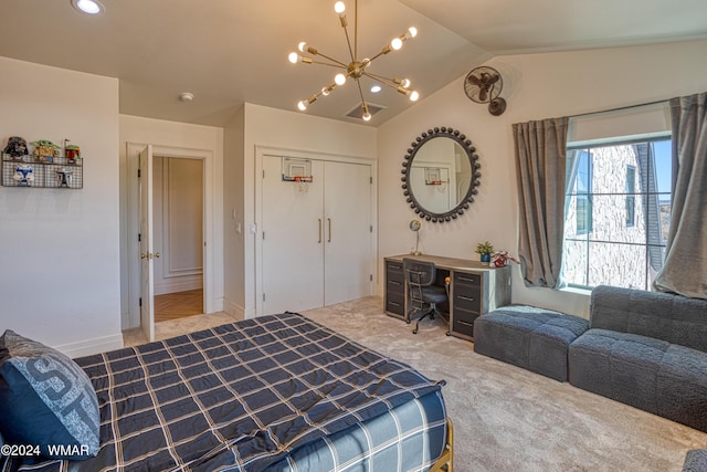 bedroom featuring lofted ceiling, a closet, light carpet, and an inviting chandelier