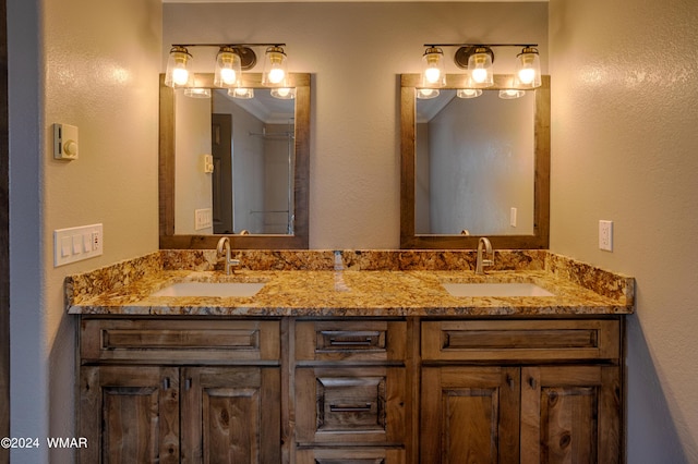 full bathroom featuring double vanity and a sink