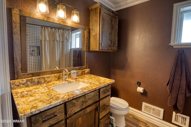 bathroom with visible vents, a textured wall, toilet, ornamental molding, and vanity