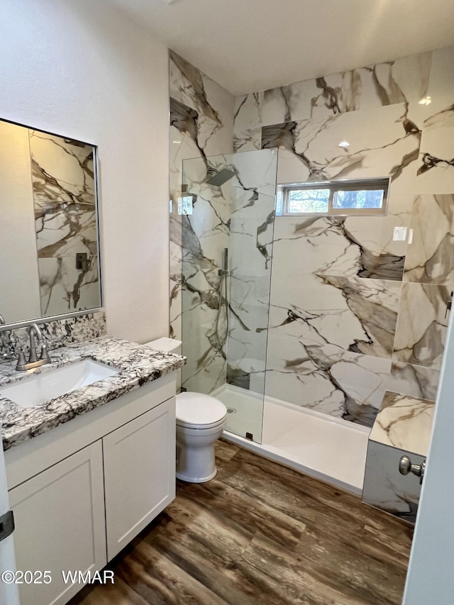 3131 State Route 277, Overgaard, AZ 85933 - bathroom with vanity, a marble finish shower, wood finished floors, and toilet