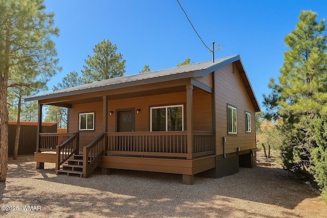 3131 State Route 277, Overgaard, AZ 85933 - view of front facade featuring metal roof and a porch