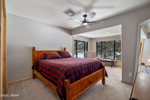 bedroom with a ceiling fan, carpet, visible vents, and baseboards